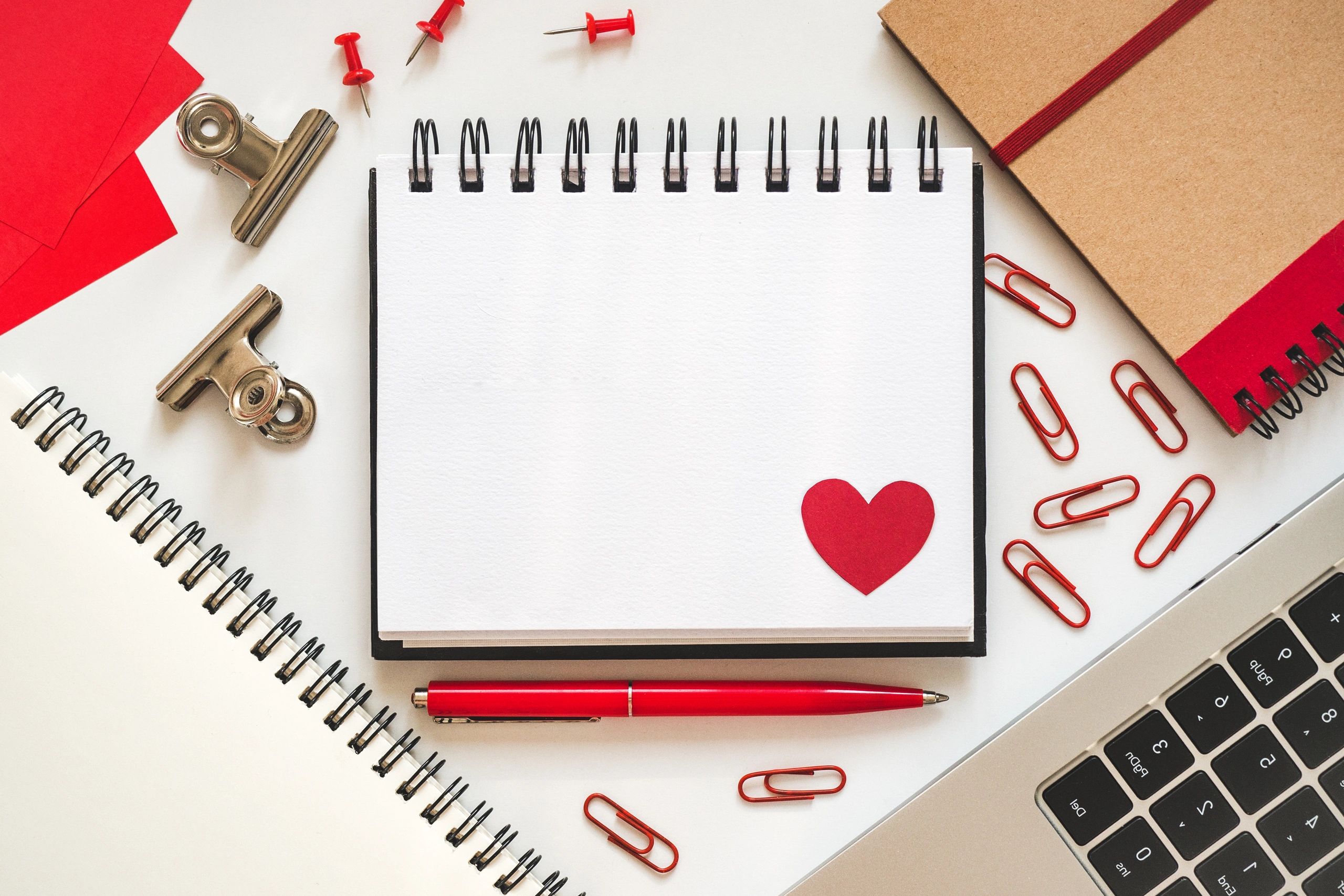Notepad page with a red heart drawing
